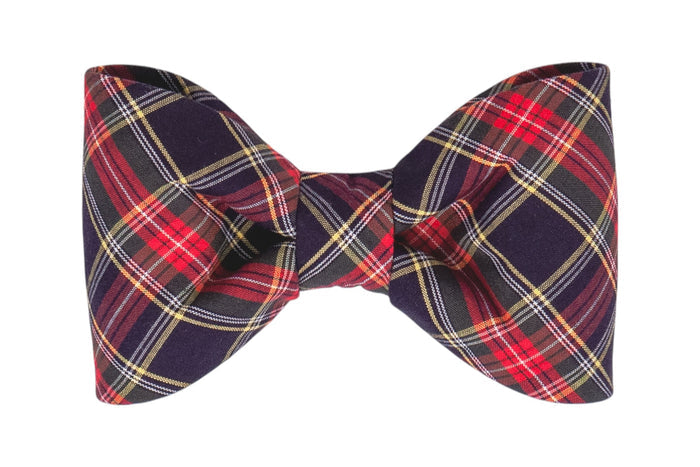 Classic tartan bow tie in red and navy, featuring smooth fabric with evenly balanced loops for a polished appearance.