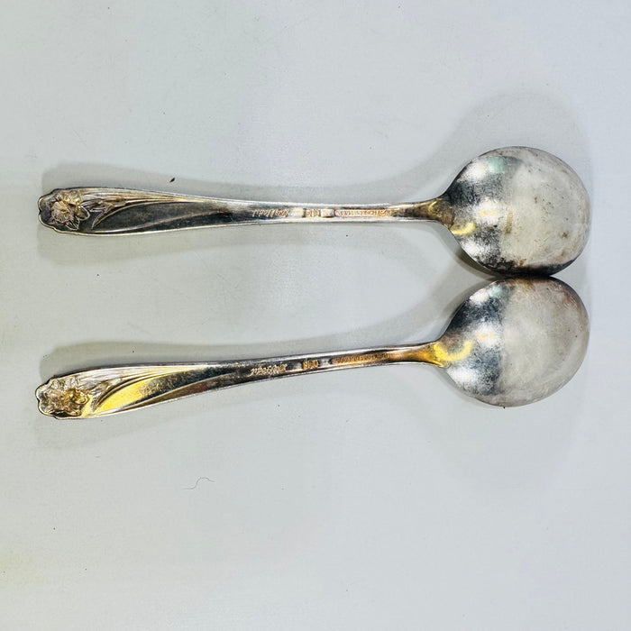 Back view of two 1847 Rogers Bros Daffodil silverplate soup spoons with marks