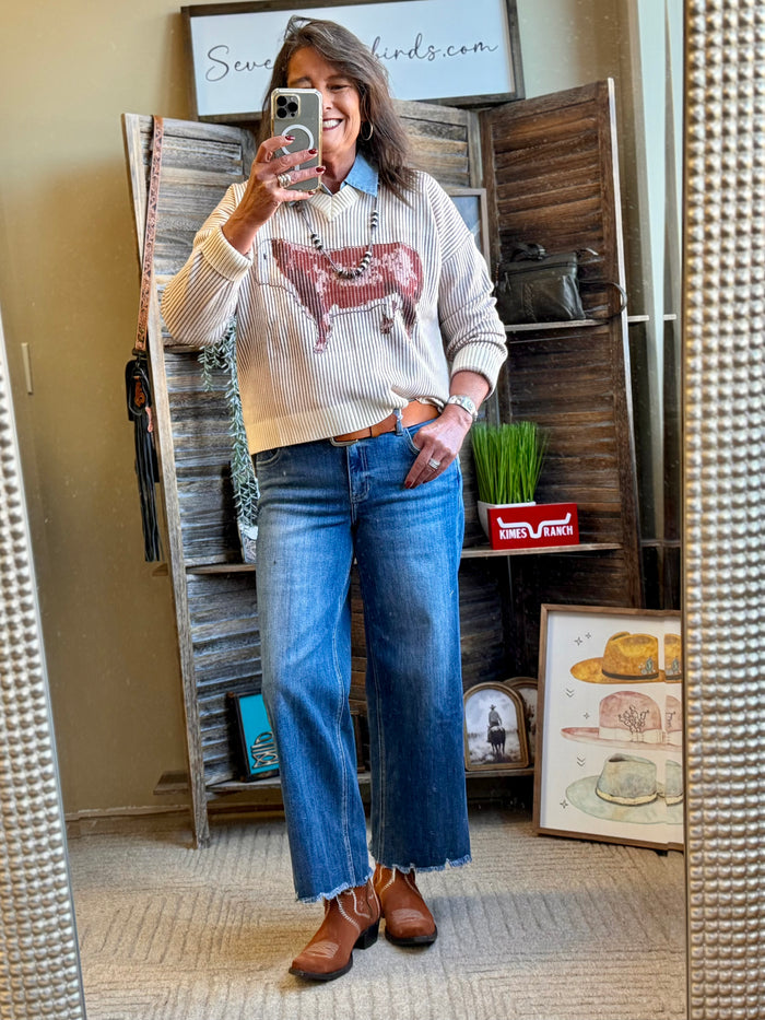 V-neck knit sweater in cream with burgundy-and-gray stripes and reindeer graphic front