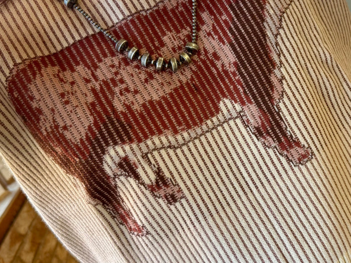 V-neck sweater in cream with burgundy and gray striped knit and reindeer graphic patch