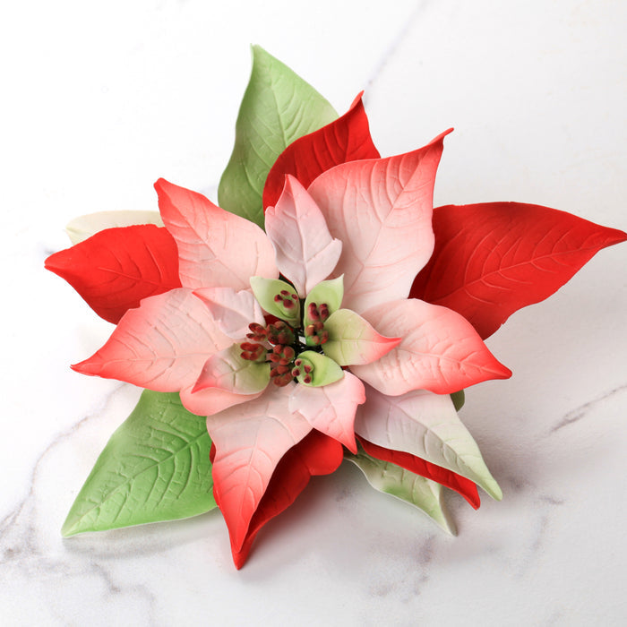 Poinsettia Gum Paste Sugar Flowers great as a cake topper for cake decorating your own holiday cakes. Perfect cake decoration for Christmas cakes and pies.
