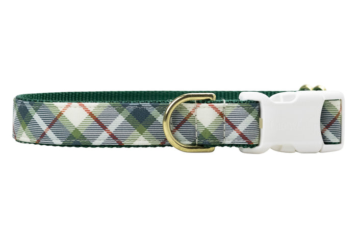 Adjustable dog collar featuring a light base with an olive green tartan plaid pattern, accented by thin diagonal lines. The collar has durable green webbing on the underside, a metal D-ring, and a quick-release buckle engraved with the brand name “Crewlala.”