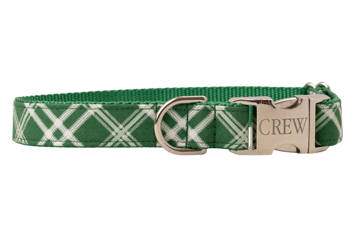 Stylish dog collar in green with intersecting plaid lines, crafted with durable nylon backing and finished with polished hardware including a buckle and leash ring.