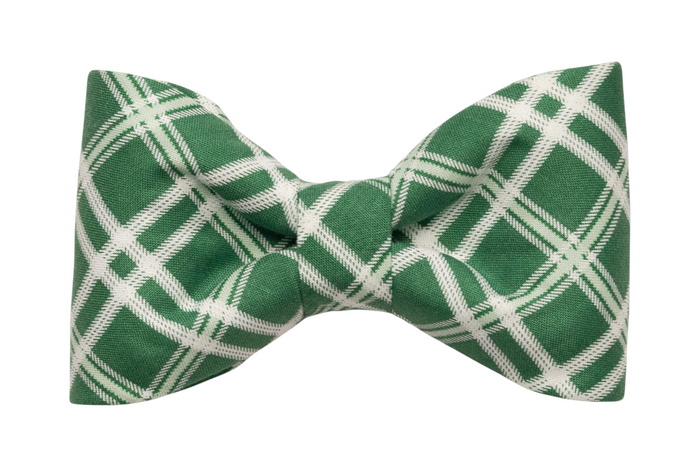 Classic pet bow tie in green with intersecting plaid lines, crafted from smooth fabric and styled with balanced folds on each side.